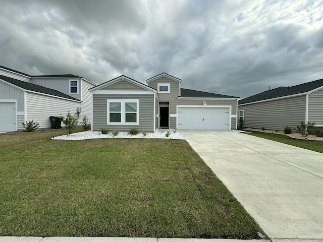 view of front of house with an attached garage, concrete driveway, and a front yard