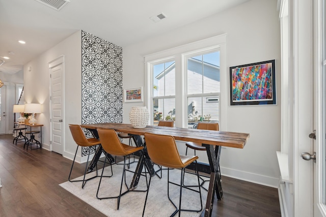 dining room with dark wood-type flooring