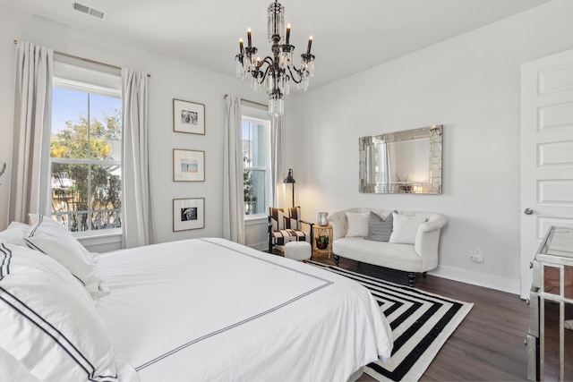 bedroom with dark wood-type flooring