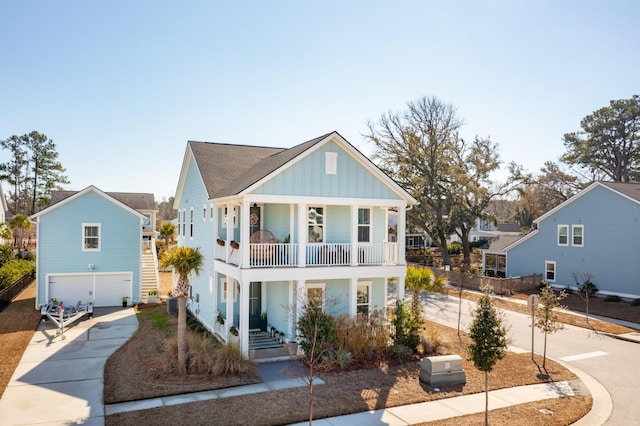 view of front of property featuring a garage and a balcony