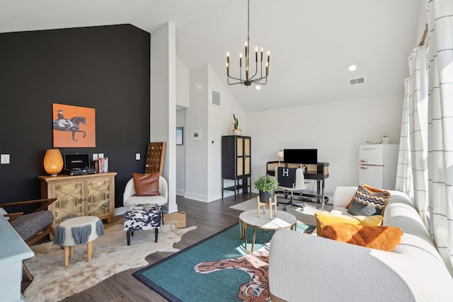 living room featuring high vaulted ceiling, hardwood / wood-style floors, and a notable chandelier