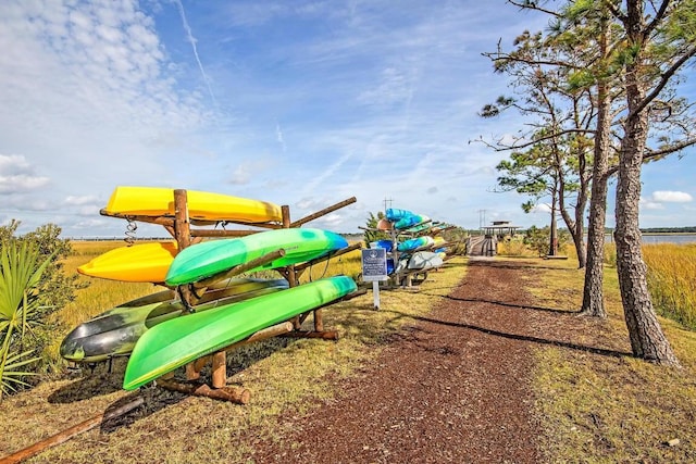 view of play area with a water view