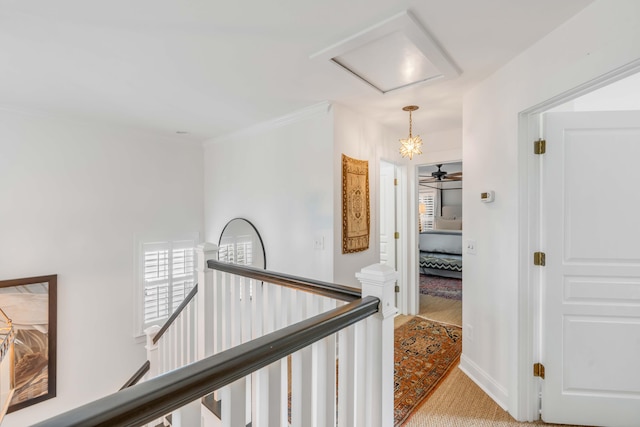 hallway with light carpet and ornamental molding