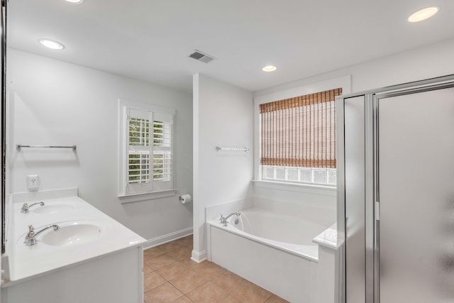 bathroom featuring tile patterned flooring, separate shower and tub, and vanity