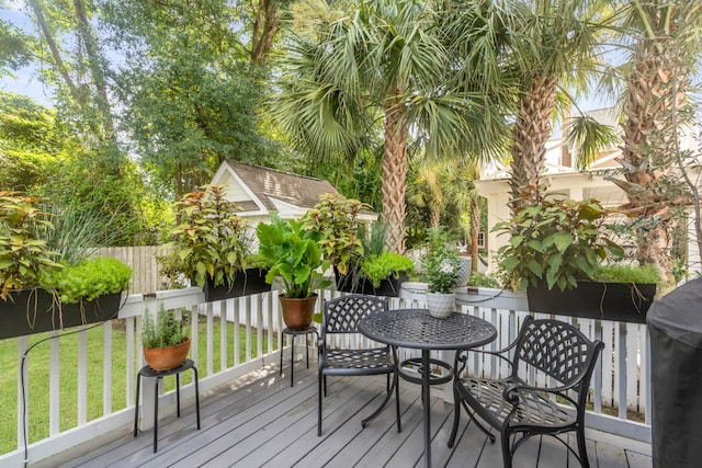 wooden deck with a yard