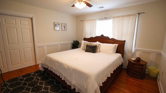 bedroom with ceiling fan and dark hardwood / wood-style floors