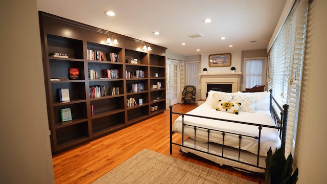 bedroom with light hardwood / wood-style floors