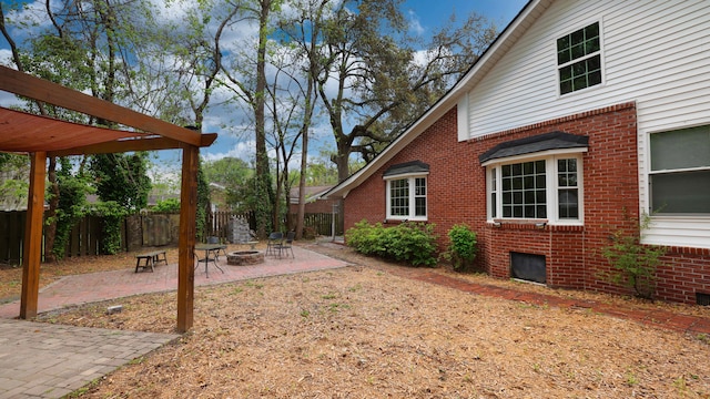 view of yard with a patio area and a fire pit