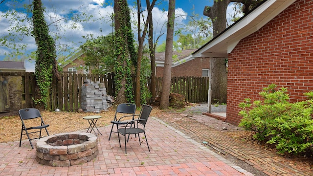 view of patio / terrace with an outdoor fire pit