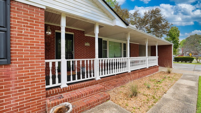 view of property exterior featuring covered porch