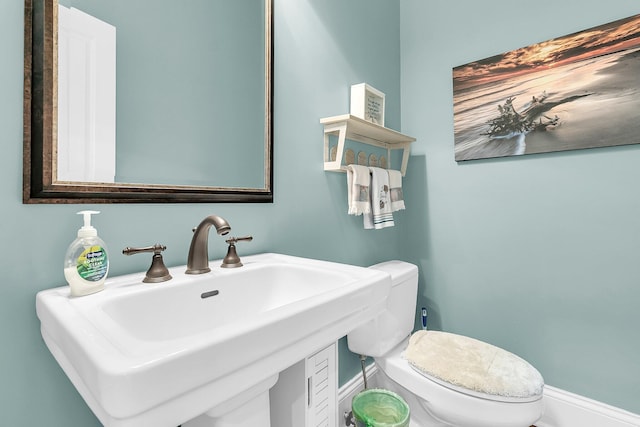 bathroom featuring sink and toilet