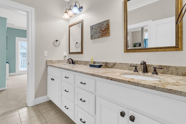 bathroom featuring tile patterned flooring and vanity