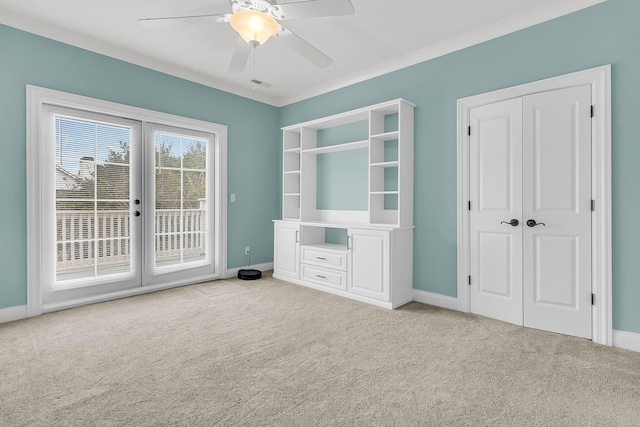 interior space with ceiling fan and french doors