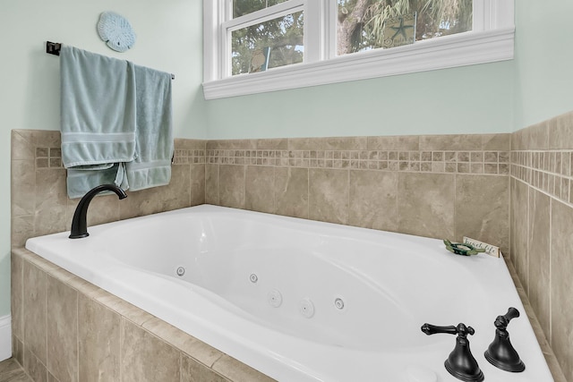 bathroom featuring tiled tub