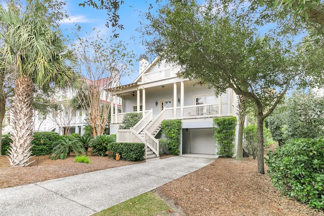 beach home with a porch and a garage