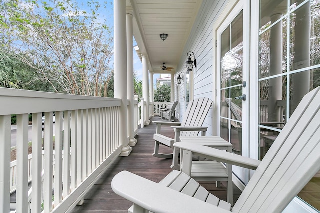 wooden terrace with a porch