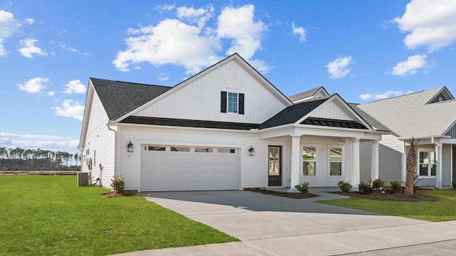 view of front facade featuring a garage, a front yard, and central air condition unit