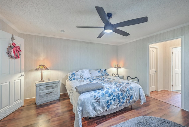 bedroom featuring a textured ceiling, ceiling fan, crown molding, and dark hardwood / wood-style floors