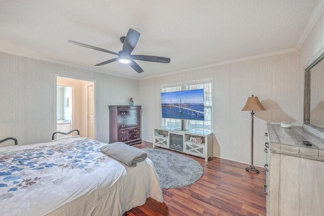 bedroom with ceiling fan, dark wood-type flooring, crown molding, and a textured ceiling