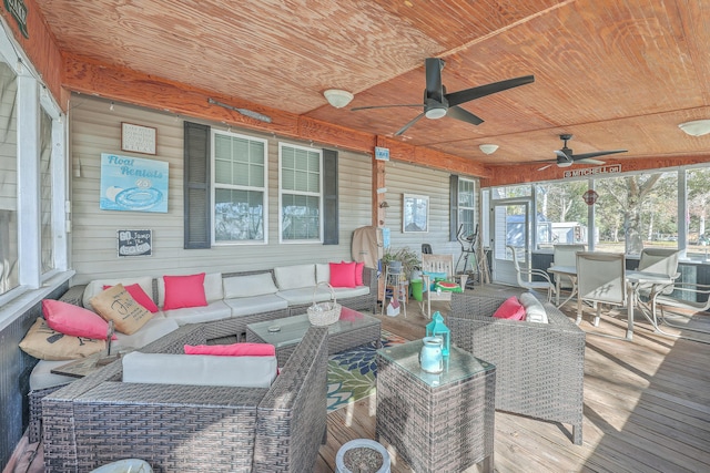 exterior space with ceiling fan and an outdoor living space