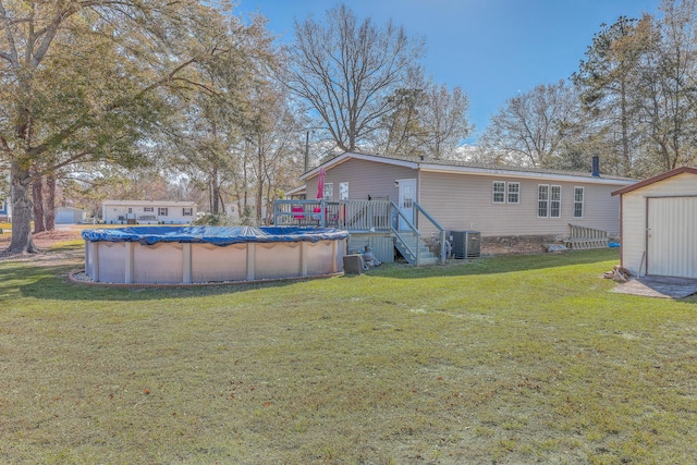 exterior space featuring central AC, a pool side deck, and a shed