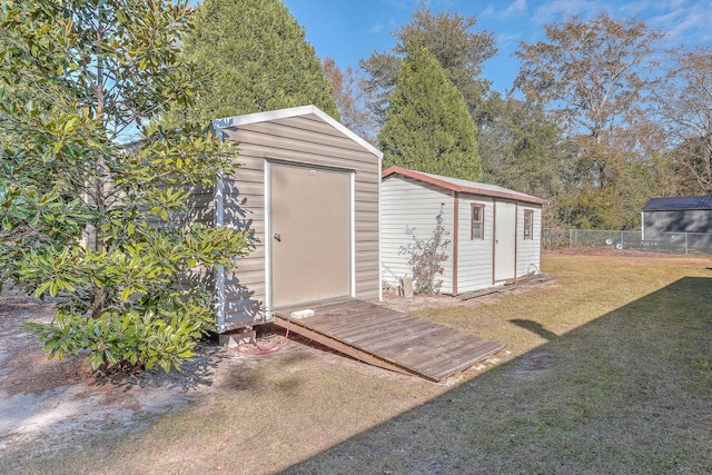 view of outbuilding featuring a yard