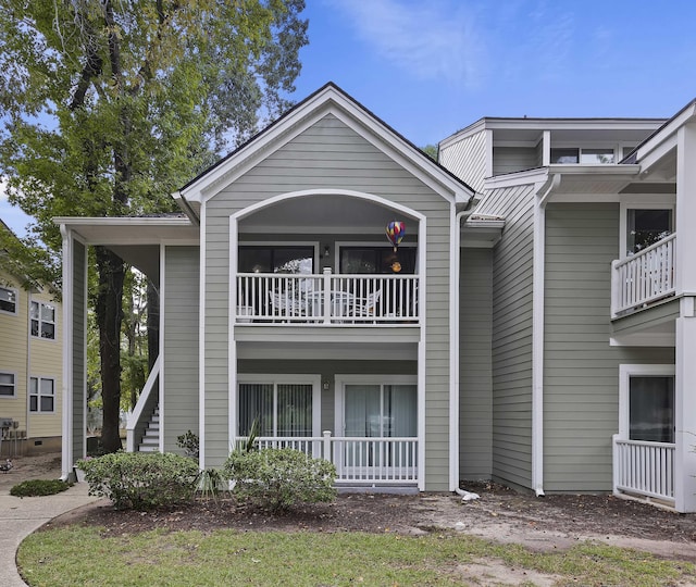 view of front of house featuring a balcony