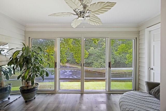 sunroom / solarium featuring ceiling fan