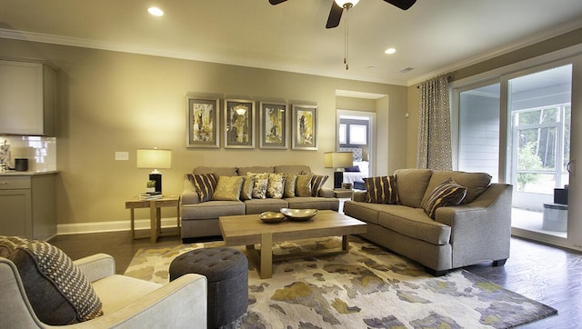 living room with ceiling fan, plenty of natural light, crown molding, and hardwood / wood-style flooring