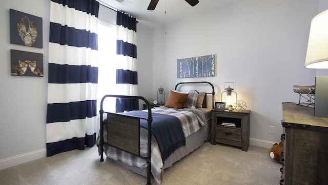 bedroom featuring ceiling fan and light carpet