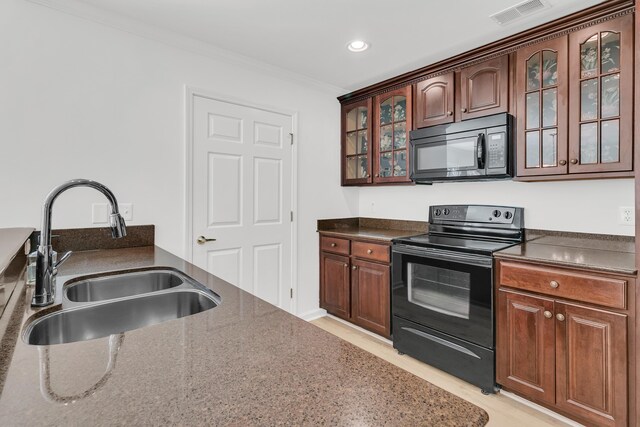4823 Shady Tree Ln, Summerville, SC 29485 - kitchen with black appliances, a sink, ornamental molding, light wood-style flooring, and glass insert cabinets