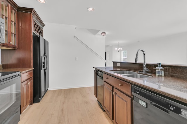 4823 Shady Tree Ln, Summerville, SC 29485 - kitchen with black appliances, a sink, a chandelier, light wood-style flooring, and glass insert cabinets