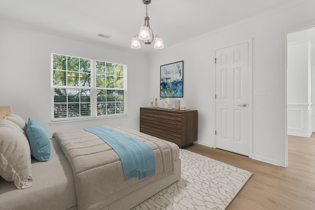 4823 Shady Tree Ln, Summerville, SC 29485 - bedroom with wood finished floors, a chandelier, ornamental molding, and baseboards