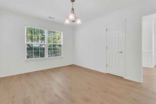 4823 Shady Tree Ln, Summerville, SC 29485 - unfurnished room with a chandelier, ornamental molding, light wood-style flooring, and baseboards