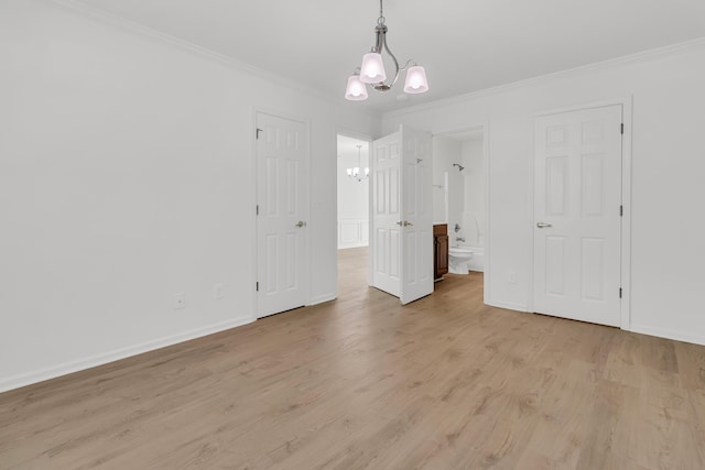 4823 Shady Tree Ln, Summerville, SC 29485 - unfurnished bedroom featuring a chandelier, ornamental molding, light wood-style flooring, baseboards, and ensuite bathroom