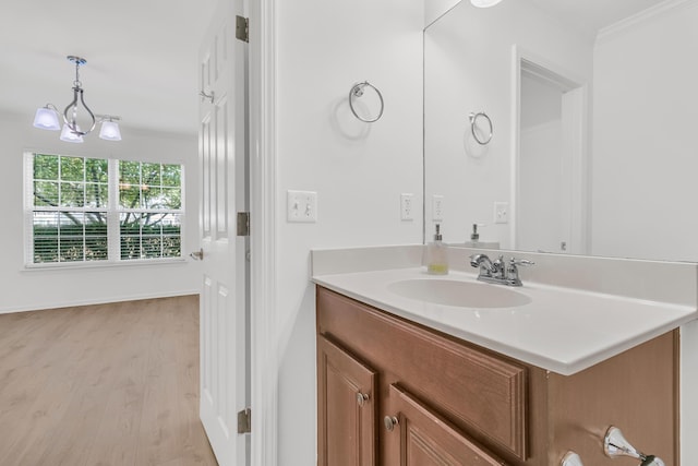 4823 Shady Tree Ln, Summerville, SC 29485 - bathroom featuring vanity, wood finished floors, ornamental molding, and a chandelier