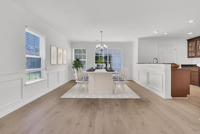 4823 Shady Tree Ln, Summerville, SC 29485 - dining space with a decorative wall, a chandelier, light wood-style floors, recessed lighting, and a wainscoted wall
