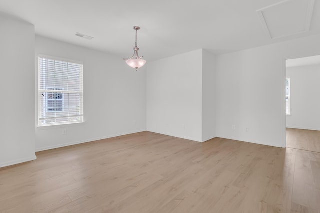 4823 Shady Tree Ln, Summerville, SC 29485 - unfurnished room featuring plenty of natural light, light wood-type flooring, attic access, and baseboards
