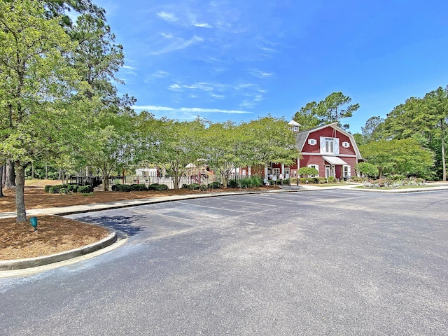 4823 Shady Tree Ln, Summerville, SC 29485 - view of asphalt road with curbs and a barn