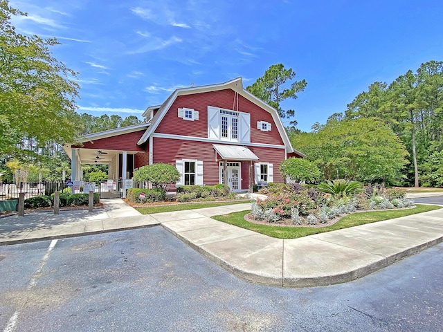 4823 Shady Tree Ln, Summerville, SC 29485 - view of front of home with a gambrel roof, a ceiling fan, french doors, and a gate