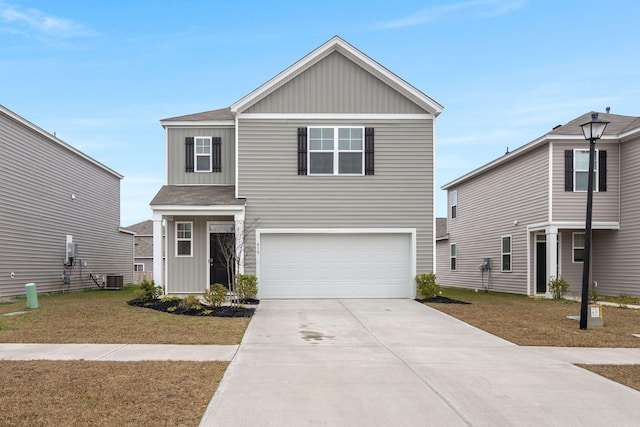 view of front property featuring cooling unit, a front yard, and a garage