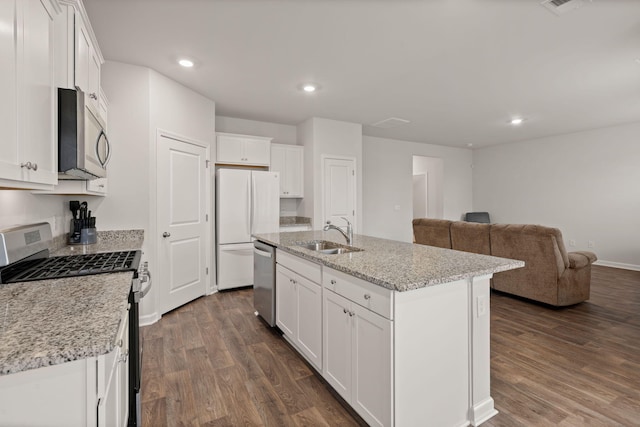 kitchen with a center island with sink, sink, appliances with stainless steel finishes, dark hardwood / wood-style flooring, and white cabinetry