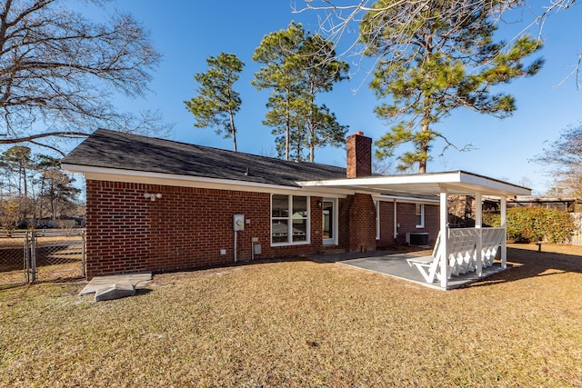 back of property with a yard and cooling unit