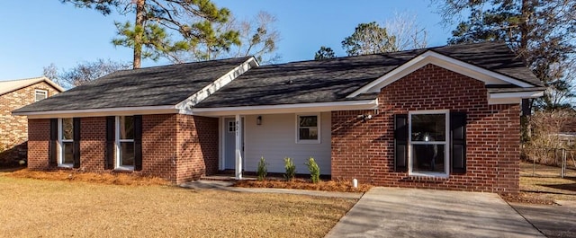 ranch-style home featuring a front yard