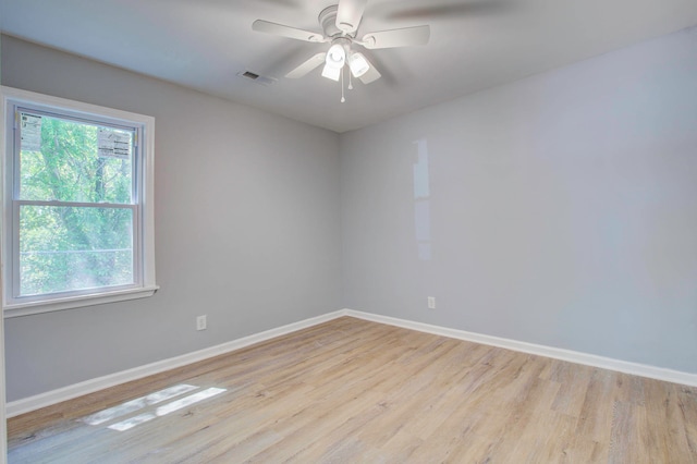 unfurnished room with light hardwood / wood-style floors and a healthy amount of sunlight