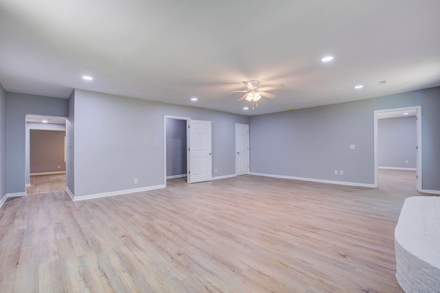 spare room featuring ceiling fan and light wood-type flooring