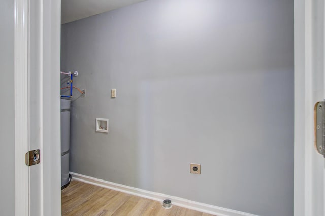 clothes washing area featuring light hardwood / wood-style flooring, electric dryer hookup, and hookup for a washing machine