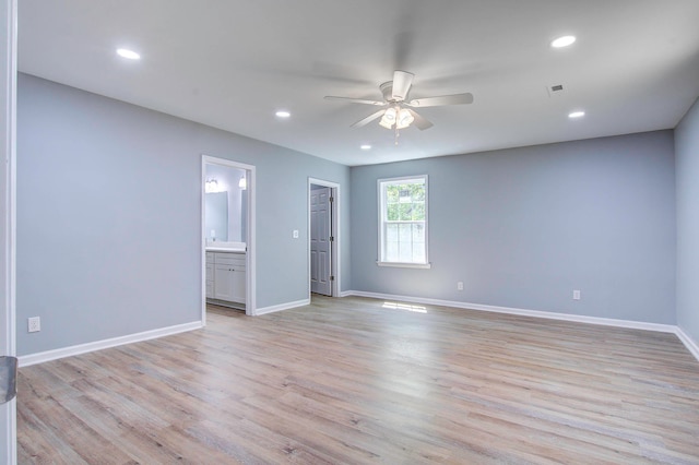 spare room featuring ceiling fan and light wood-type flooring