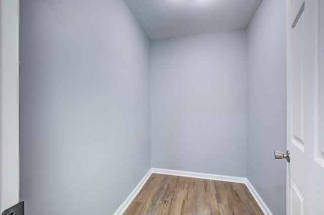 unfurnished room with wood-type flooring