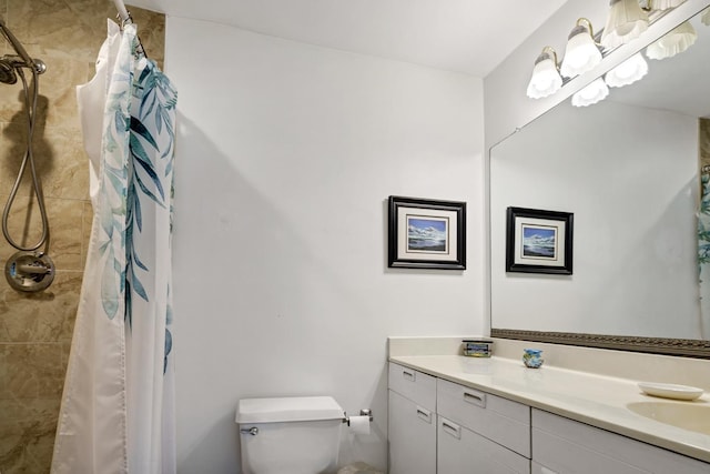 bathroom featuring vanity, toilet, and a shower with shower curtain